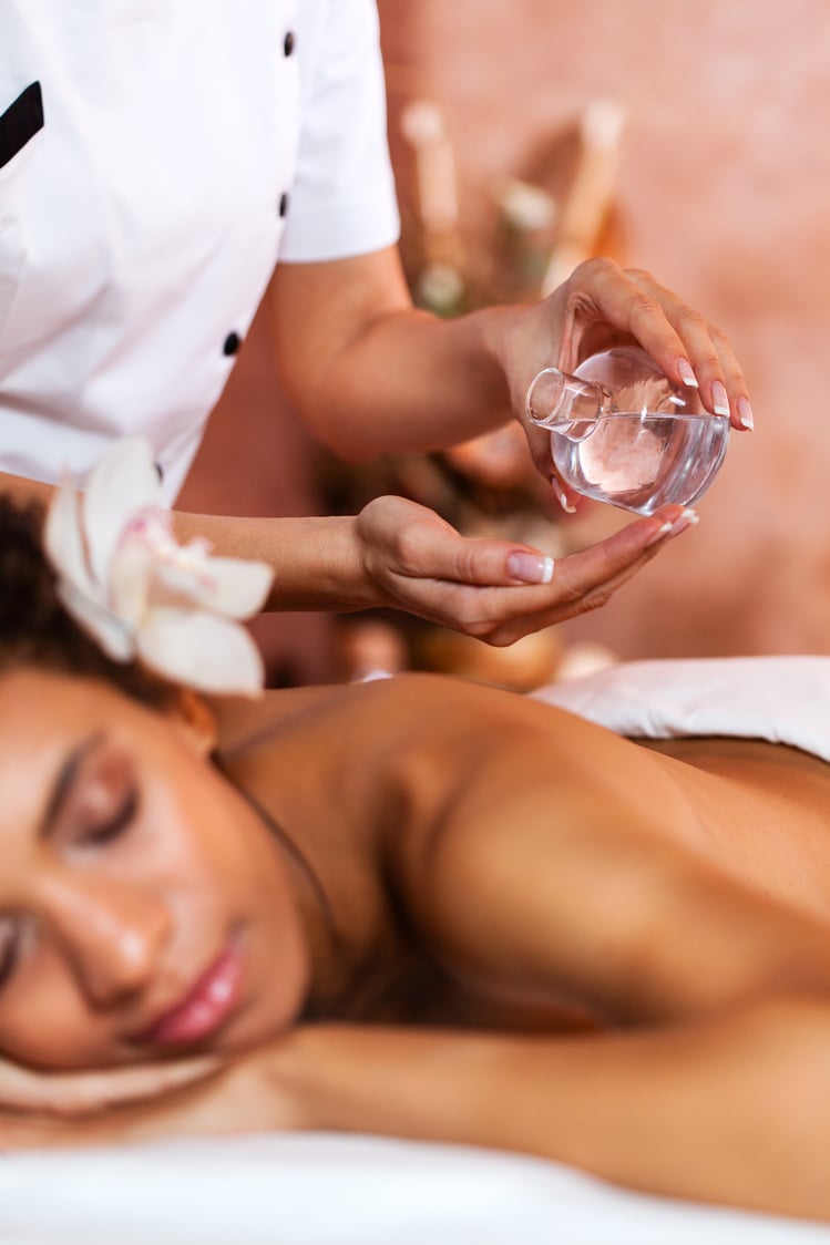 Aromatherapy - Therapist pouring massage oil